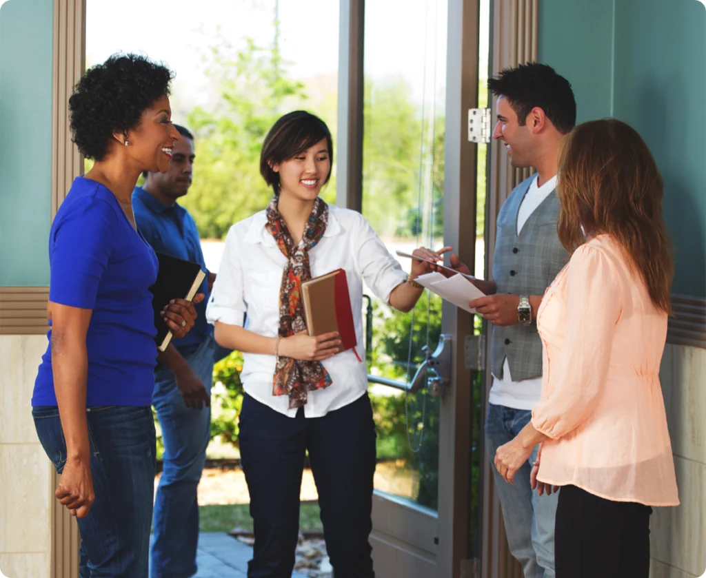 Greeters welcoming people at the church door